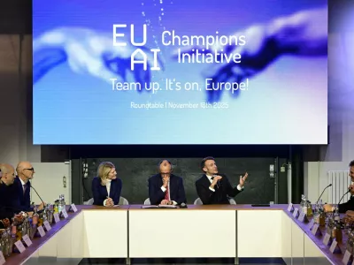 France's President Emmanuel Macron addresses investors next to German chancellor Friedrich Merz and Managing director and Head of Europe at General Catalyst Jeannette zu F&uuml;rstenberg at the EU AI Champions Initiative at a summit on Europe's technological sovereignty, in the EUREF Campus in Berlin, Germany, November 18, 2025. JOHN MACDOUGALL/Pool via REUTERS