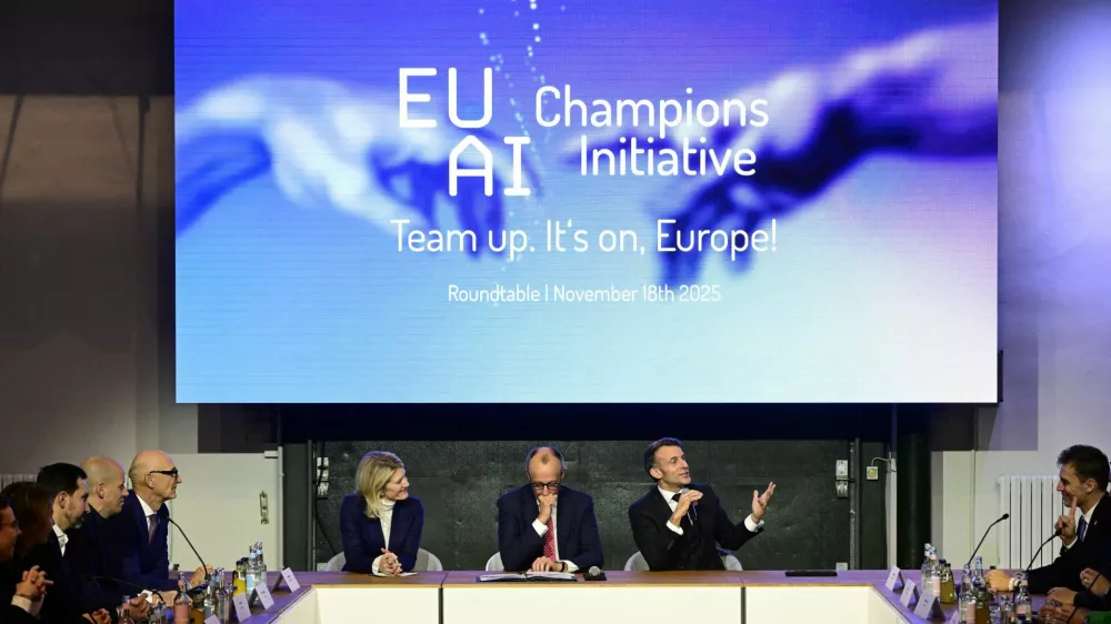 France's President Emmanuel Macron addresses investors next to German chancellor Friedrich Merz and Managing director and Head of Europe at General Catalyst Jeannette zu F&uuml;rstenberg at the EU AI Champions Initiative at a summit on Europe's technological sovereignty, in the EUREF Campus in Berlin, Germany, November 18, 2025. JOHN MACDOUGALL/Pool via REUTERS