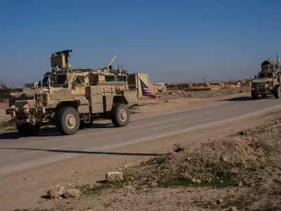 FILE - A U.S. military convoy drives along a road in northeastern Syria's Hasakeh province, Thursday, Jan. 30, 2025. (AP Photo/Bernat Armangue, File)