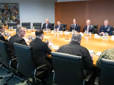 HANDOUT - 14 December 2025, Berlin: (L-R) Guenter Sautter, foreign and security policy adviser to German Chancellor Friedrich Merz, Chancellor Merz, Ukrainian President Volodymyr Zelensky, and former defence minister Rustem Umjerow sit opposite the US delegation at the start of their meeting at the Federal Chancellery, including Jared Kushner (centre, back row) and US special envoy Steve Witkoff (second right, back row). US representatives are in Berlin to discuss a possible ceasefire with Ukrainian and European officials. Photo: Guido Bergmann/Presse- und Informationsamt der Bundesregierung - ATTENTION: editorial use only and only if the credit mentioned above is referenced in full