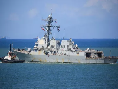 FILE PHOTO: The U.S. Navy destroyer USS Gravely (DDG-107) sails from the Port of Spain amid heightened tensions in the region between the U.S. and Venezuela, as seen from Port of Spain, Trinidad and Tobago October 30, 2025. REUTERS/Andrea de Silva/File Photo