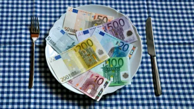 Illustration - Euro bills lie on a plate in Germany, 22 March 2011. Photo by: Berliner Verlag/Steinach/picture-alliance/dpa/AP Images