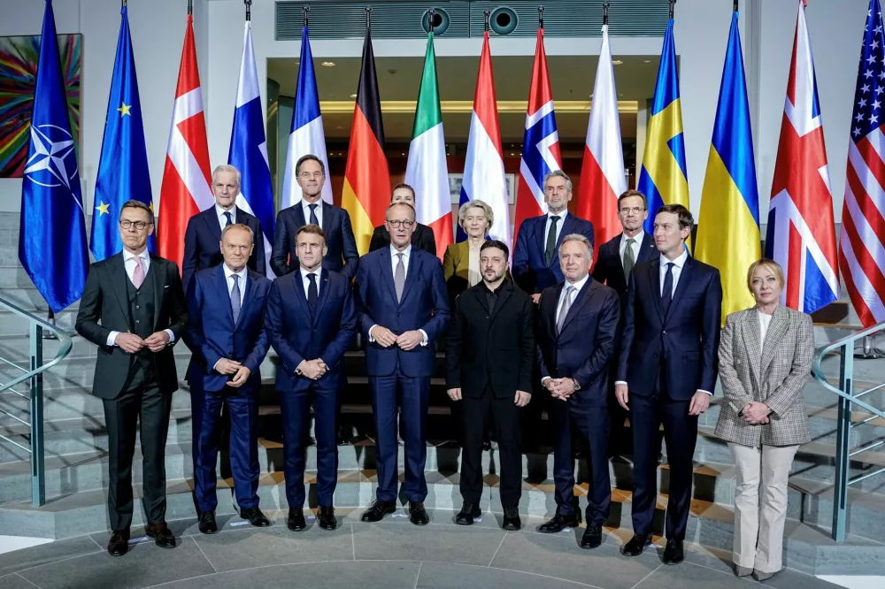 Ukraine's President Volodymyr Zelenskiy, U.S. President Donald Trump's son-in-law Jared Kushner, U.S. Special Envoy Steve Witkoff and German Chancellor Friedrich Merz gather for a family photo together with French President Emmanuel Macron, European Commission President Ursula von der Leyen, NATO Secretary General Mark Rutte, Denmark's Prime Minister Mette Frederiksen, Finland's President Alexander Stubb, Italian Prime Minister Giorgia Meloni, Norway's Prime Minister Jonas Gahr Store, Poland's Prime Minister Donald Tusk and Dutch Prime Minister Dick Schoof, at the Chancellery in Berlin, Germany, December 15, 2025.  Kay Nietfeld/Pool via Reuters