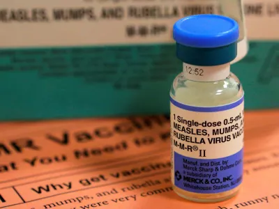 FILE PHOTO: A vial of measles, mumps and rubella vaccine and an information sheet is seen at Boston Children's Hospital in Boston, Massachusetts February 26, 2015.  REUTERS/Brian Snyder/File Photo