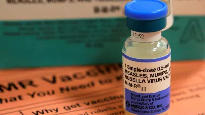 FILE PHOTO: A vial of measles, mumps and rubella vaccine and an information sheet is seen at Boston Children's Hospital in Boston, Massachusetts February 26, 2015.  REUTERS/Brian Snyder/File Photo