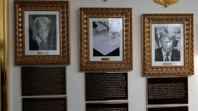 Portraits of U.S President Donald Trump flank an image of an autopen signing former U.S. President Joe Biden's signature in place of a portrait of Biden on the "Presidential Walk of Fame" along the White House Colonnade in Washington, D.C., U.S., December 17, 2025. REUTERS/Jessica Koscielniak