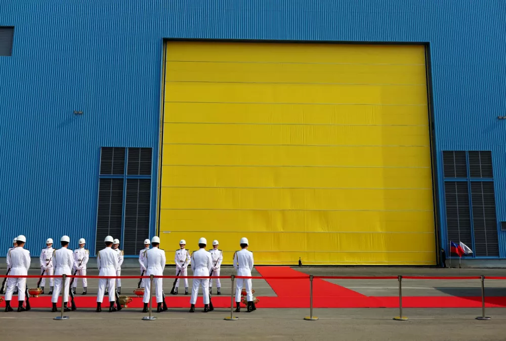 FILE PHOTO: Honer guards stand outside the factory of the new submarine fleet being built by CSBC Corporation in Kaohsiung, Taiwan, November 24, 2020. Picture taken November 24, 2020. REUTERS/Ann Wang To match Special Report TAIWAN-CHINA/SUBMARINES/File Photo