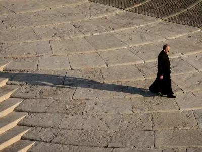 A priest walks at St. Peter's Square, ahead of the funeral Mass of Pope Francis, at the Vatican, April 26, 2025. REUTERS/Remo Casilli   TPX IMAGES OF THE DAY      SEARCH "2025 STORIES BEST" FOR THIS STORY. SEARCH "REUTERS YEAR-END" FOR ALL 202X YEAR END GALLERIES.