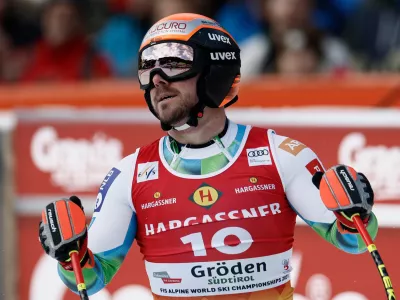 Slovenia's Miha Hrobat reacts at the finish area of an alpine ski, men's World Cup downhill, in Val Gardena, Italy, Thursday, Dec. 18, 2025. (AP Photo/Gabriele Facciotti)