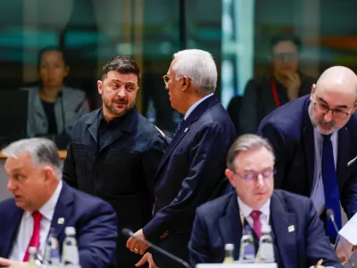 Ukrainian President Volodymyr Zelenskiy speaks with European Council President Antonio Costa as they attend a European Union leaders' summit in Brussels, Belgium, December 18, 2025. REUTERS/Stephanie Lecocq/Pool