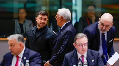 Ukrainian President Volodymyr Zelenskiy speaks with European Council President Antonio Costa as they attend a European Union leaders' summit in Brussels, Belgium, December 18, 2025. REUTERS/Stephanie Lecocq/Pool