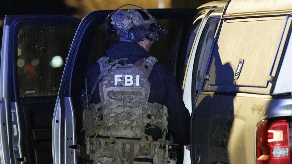 A member of the FBI returns equipment to their vehicle at a storage facility where the Brown University shooter, identified by authorities as Claudio Neves Valente, took his own life, in Salem, New Hampshire, U.S., December 18, 2025. REUTERS/CJ Gunther