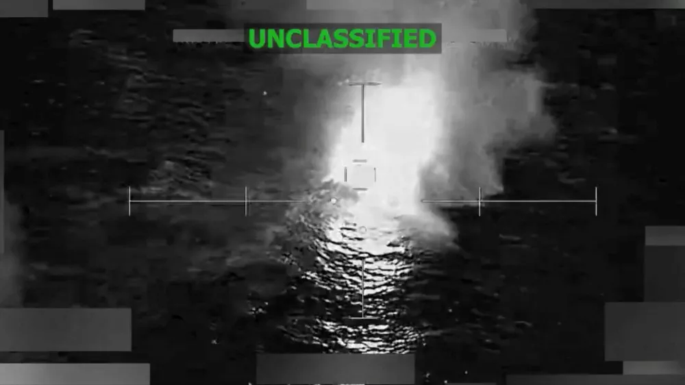 A vessel that the U.S. military said was suspected of smuggling drugs, burns after being struck with a kinetic weapon in a location given as the Eastern Pacific, in this screengrab taken from a handout video released December 18, 2025. U.S. Southern Command/Handout via REUTERS. THIS IMAGE HAS BEEN SUPPLIED BY A THIRD PARTY. TEXT OVERLAY AND BLURRING FROM SOURCE. VERIFICATION LINES: Reuters was not able to independently verify the location or the date when the video was filmed. Upon checking this footage, no old results were found.