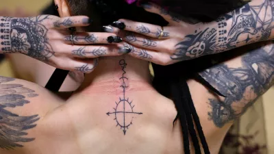 A 33-year-old Australian woman who says she is in a romantic relationship with Japanese manga character Mephisto Pheles shows a tattoo symbolizing the character before their ceremonial wedding at the traditional guest house Rinkokaku in Maebashi, Japan, March 14, 2025. REUTERS/Kim Kyung-Hoon  SEARCH "JAPAN KYUNG-HOON AI WEDDING" FOR THIS STORY. SEARCH "WIDER IMAGE" FOR ALL STORIES.