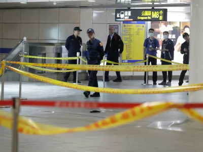 Taiwan police cordoned off the scene after a knife attack in Taipei, Taiwan, Friday, Dec. 19, 2025. (AP Photo/Chiang Ying-ying)