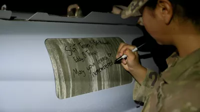 U.S. soldiers attached to the Iowa National Guard sign GBU-31 munitions systems in the U.S. Central Command area of responsibility Dec. 18, 2025 as the U.S. military launched large-scale strikes against dozens of Islamic State targets in Syria in retaliation for an attack on U.S. personnel, U.S. officials said. U.S. Air Force Photo/Handout via REUTERS THIS IMAGE HAS BEEN SUPPLIED BY A THIRD PARTY