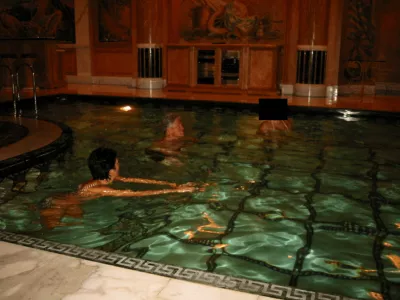 Former U.S. President Bill Clinton swims in a pool in this image released by the Department of Justice in Washington, D.C., U.S., on December 19, 2025 as part of a new trove of documents from its investigations into the late financier and convicted sex offender Jeffrey Epstein. U.S. Justice Department/Handout via REUTERS  THIS IMAGE HAS BEEN SUPPLIED BY A THIRD PARTY REDACTED AREAS FROM SOURCE. THIS PICTURE WAS PROCESSED BY REUTERS TO ENHANCE QUALITY. AN UNPROCESSED VERSION HAS BEEN PROVIDED SEPARATELY.
