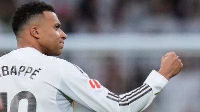 Real Madrid's Kylian Mbappe celebrates after scoring his sides second goal from the penalty spot during the Spanish La Liga soccer match between Real Madrid and Sevilla in Madrid, Spain, Saturday, Dec. 20, 2025. (AP Photo/Manu Fernandez)
