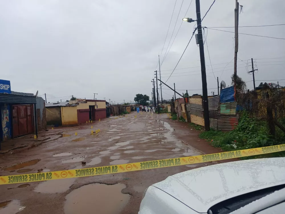 Photo marker cones are placed across the scene after an early morning shooting in Bekkersdal township south-west of Johannesburg, South Africa, December 21, 2025. South African Police Services/Handout via REUTERS. ATTENTION EDITORS &ndash; THIS IMAGE HAS BEEN SUPPLIED BY A THIRD PARTY.