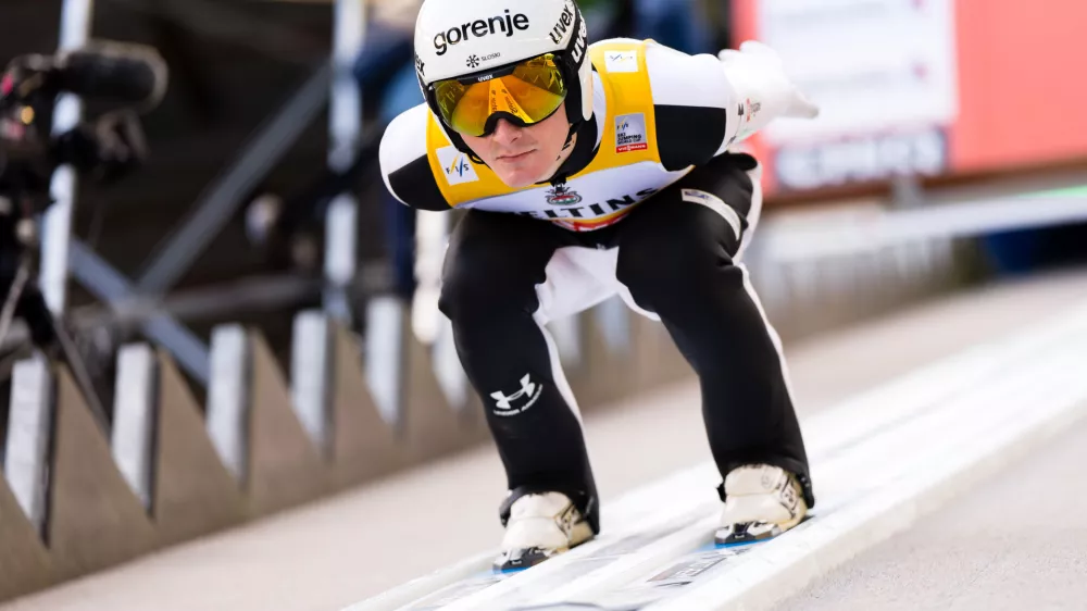 Domen Prevc of Slovenia speeds down the slope during the men's FIS Ski Jumping World Cup competition at the Gross-Titlis Schanze, in Engelberg, Switzerland, Saturday, Dec. 20, 2025. (Urs Flueeler/Keystone via AP)