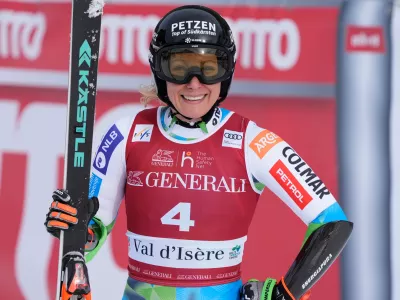 Slovenia's Ilka Stuhec celebrates at the finish area of an alpine ski, women's World Cup super-G in Val d'Isere, France, Sunday, Dec. 21, 2025. (AP Photo/Giovanni Auletta)