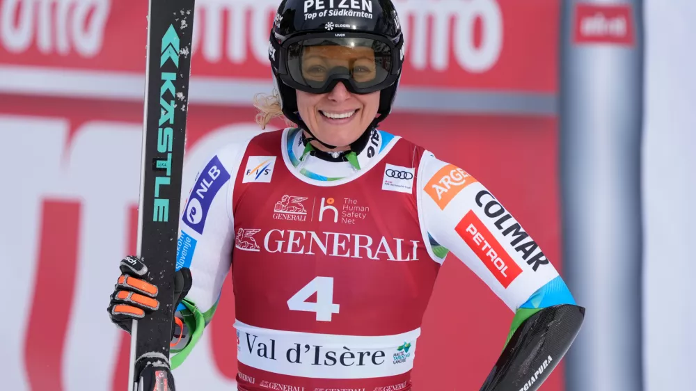 Slovenia's Ilka Stuhec celebrates at the finish area of an alpine ski, women's World Cup super-G in Val d'Isere, France, Sunday, Dec. 21, 2025. (AP Photo/Giovanni Auletta)
