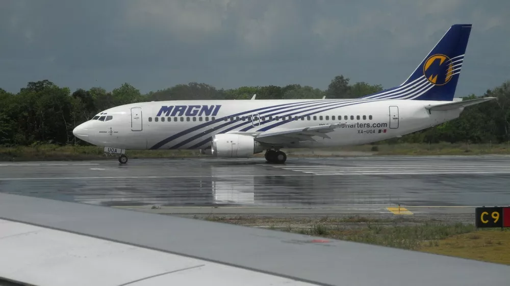 A Magni Boeing 737 taxies on a runway at Cancun airport, Quintana Roo State, Mexico, on May 26, 2019.   Magnicharters is a Mexican airline based in Mexico City which operates flights in Mexico and to/from the United States and the Dominican Republic as well as charter flights.,Image: 438620608, License: Rights-managed, Restrictions:, Model Release: no