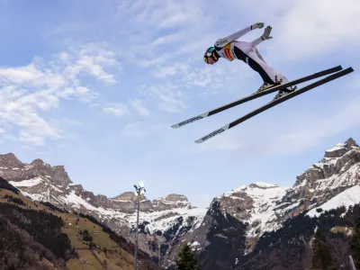 Domen Prevc of Slovenia soars through the air during the men's FIS Ski Jumping World Cup competition at the Gross-Titlis Schanze, in Engelberg, Switzerland, Saturday, Dec. 20, 2025. (Philipp Schmidli/Keystone via AP)