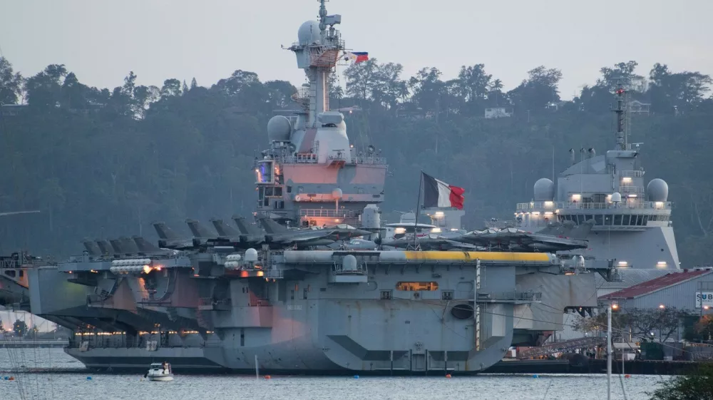 The French aircraft carrier Charles de Gaulle is seen at the former US naval base in Subic Bay, Zambales province, north of Manila on February 23, 2025. The aircraft carrier strike group, which includes a trio of destroyers, joined the Philippine Navy on February 21 for drills in the South China Sea that Manila said were aimed at enhancing "interoperability, communication, and defense capabilities".,Image: 967966197, License: Rights-managed, Restrictions:, Model Release: no