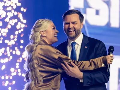 Erika Kirk greets Vice President JD Vance during Turning Point USA's AmericaFest 2025, Sunday, Dec. 21, 2025, in Phoenix. (AP Photo/Jon Cherry)