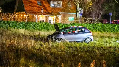 22 December 2025, Netherlands, Nunspeet: A car stands in the grass after a serious accident on the Elburgerweg. A car has driven into a crowd of people in the Netherlands. Photo: -/ANP/dpa