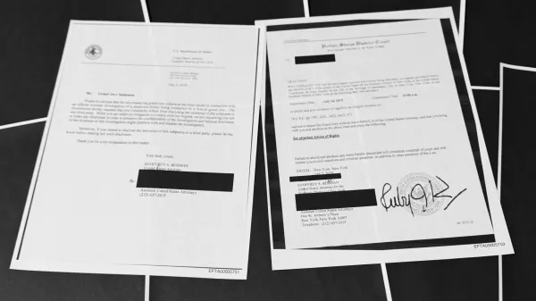 Pages that show New York grand jury subpoenas being issued into the Jeffrey Epstein and Ghislaine Maxwell investigation, then pages of redactions that follow, in this document released by the U.S. Justice Department, are photographed, Friday, Dec. 19, 2025, in Washington. (AP Photo/Jon Elswick)