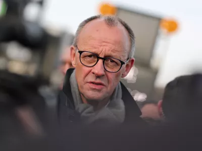22 December 2025, North Rhine-Westphalia, L&uuml;denscheid: German Chancellor Friedrich Merz speaks in an interview after the opening of the Rahmedetal bridge. The important A45 north-south axis in the Sauerland region was interrupted for almost four years due to a dilapidated bridge. The dilapidated bridge was closed at the beginning of December 2021 and later blown up. Photo: Rolf Vennenbernd/dpa