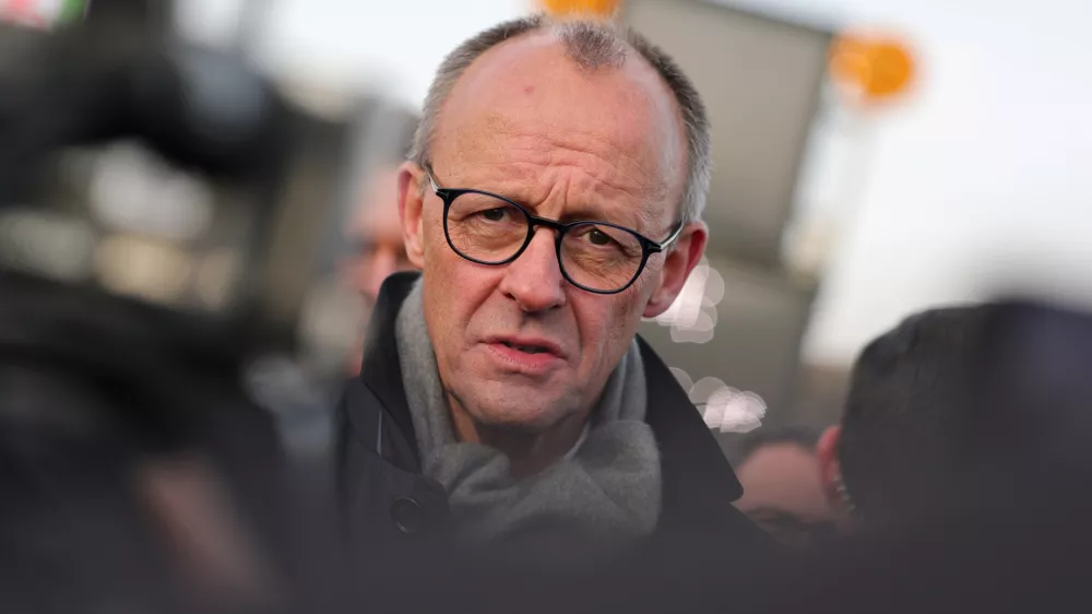 22 December 2025, North Rhine-Westphalia, L&uuml;denscheid: German Chancellor Friedrich Merz speaks in an interview after the opening of the Rahmedetal bridge. The important A45 north-south axis in the Sauerland region was interrupted for almost four years due to a dilapidated bridge. The dilapidated bridge was closed at the beginning of December 2021 and later blown up. Photo: Rolf Vennenbernd/dpa