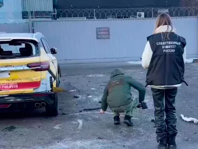 This image taken from video provided by Investigative Committee of Moscow, shows investigators working near the scene of a deadly explosion in Moscow, Wednesday, Dec. 24, 2025. (Investigative Committee of Moscow via AP)