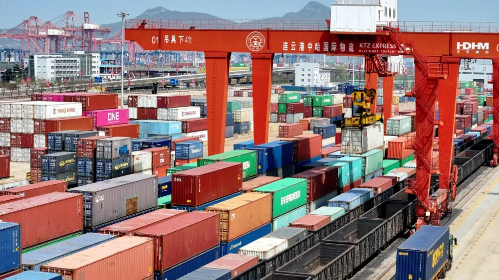 FILE PHOTO: Cargos are uploaded onto a China-Europe freight train at the China-Kazakhstan (Lianyungang) Logistics Cooperation Base in Lianyungang, Jiangsu province, China April 10, 2025. China Daily via REUTERS ATTENTION EDITORS - THIS IMAGE WAS PROVIDED BY A THIRD PARTY. CHINA OUT. NO COMMERCIAL OR EDITORIAL SALES IN CHINA./File Photo