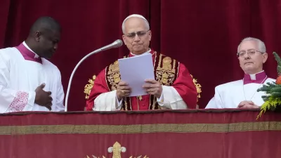 Pope Leo XIV delivers the Urbi et Orbi (Latin for 'to the city and to the world') Christmas' day blessing from the main balcony of St. Peter's Basilica at the Vatican, Thursday, Dec. 25, 2025. (AP Photo/Gregorio Borgia)