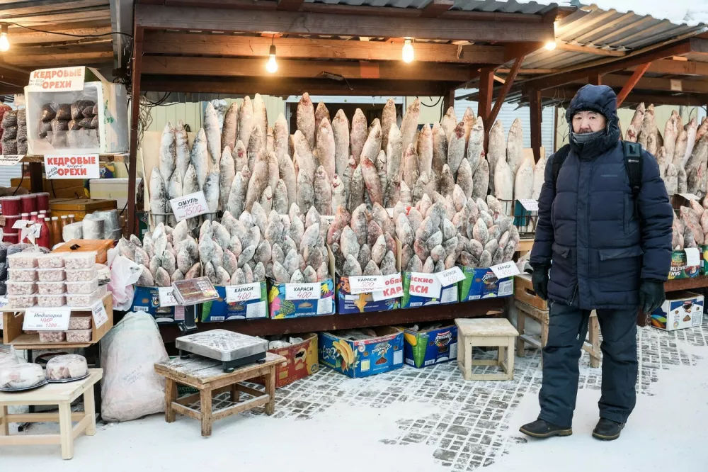 RUSSIA, YAKUTSK - DECEMBER 12, 2025: A man is seen at Krestyansky Market as temperatures plunge to as low as -45C [-43F],Image: 1058701466, License: Rights-managed, Restrictions: * Switzerland And Russia Rights Out *, Model Release: no