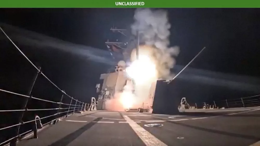 A missile is launched from a military vessel at an unidentified location, in this screen grab obtained from a handout video released by the Department of War on December 25, 2025. U.S. Department of War Via X/Handout via REUTERS  THIS IMAGE HAS BEEN SUPPLIED BY A THIRD PARTY. TEXT OVERLAY FROM SOURCE. VERIFICATION LINES: Reuters was not able to independently verify the location or the date when the video was filmed.