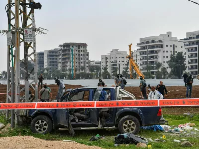 Israeli security forces inspect the scene where a vehicle was used by assailant in a suspected ramming and stabbing attack that killed two people in northern Israel according to Israeli authorities, in Afula, Israel December 26, 2025. REUTERS/Gil Eliyahu ISRAEL OUT. NO COMMERCIAL OR EDITORIAL SALES IN ISRAEL   TPX IMAGES OF THE DAY