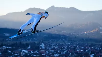 Domen Prevc, of Slovenia, soars through the air during a trial jump at the first stage of the Four Hills ski jumping tournament in Oberstdorf, Germany, Sunday, Dec. 28, 2025. (AP Photo/Matthias Schrader)