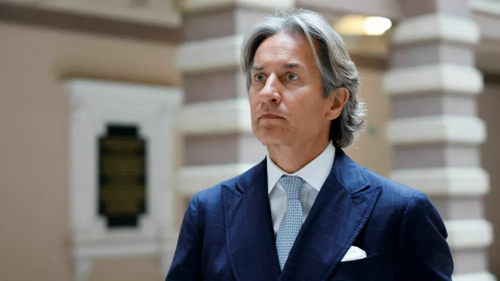 Former Austrian Finance Minister Karl-Heinz Grasser leaves after the announcement of the verdict in his appeal process on the high court in Vienna, Austria, March 25, 2025.REUTERS/Lisa Leutner 