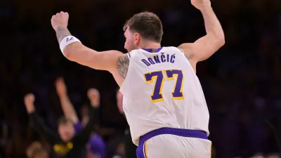Dec 28, 2025; Los Angeles, California, USA; Los Angeles Lakers guard Luka Doncic (77) reacts after a 3-point basket in the second half against the Sacramento Kings at Crypto.com Arena. Mandatory Credit: Jayne Kamin-Oncea-Imagn Images