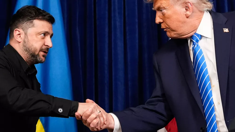 President Donald Trump and Ukraine's President Volodymyr Zelenskyy shake hands at the start of a joint news conference following a meeting at Trump's Mar-a-Lago club, Sunday, Dec. 28, 2025, in Palm Beach, Fla. (AP Photo/Alex Brandon)