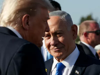 Israeli Prime Minister Benjamin Netanyahu looks on next to U.S. President Donald Trump as Trump leaves Israel en route to Sharm El-Sheikh, Egypt, to attend a world leaders' summit on ending the Gaza war, amid a U.S.-brokered prisoner-hostage swap and ceasefire deal between Israel and Hamas, at Ben Gurion International Airport in Lod, Israel, October 13, 2025. REUTERS/Evelyn Hockstein