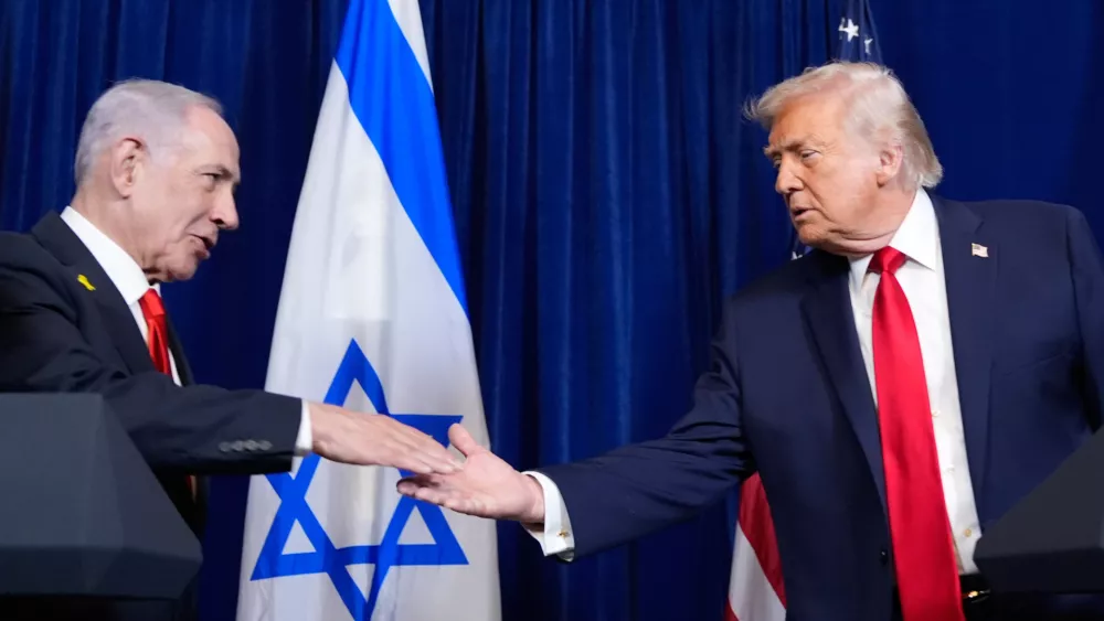 President Donald Trump shakes hands with Israel's Prime Minister Benjamin Netanyahu during a news conference at Mar-a-Lago, Monday, Dec. 29, 2025, in Palm Beach, Fla. (AP Photo/Alex Brandon)