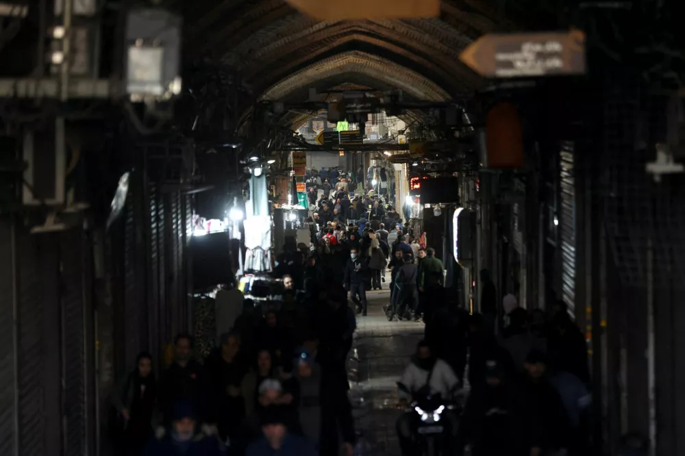 People walk past closed shops, following protests over a plunge in the currency's value, in the Tehran Grand Bazaar in Tehran, Iran, December 30, 2025. Majid Asgaripour/WANA (West Asia News Agency) via REUTERS ATTENTION EDITORS - THIS PICTURE WAS PROVIDED BY A THIRD PARTY