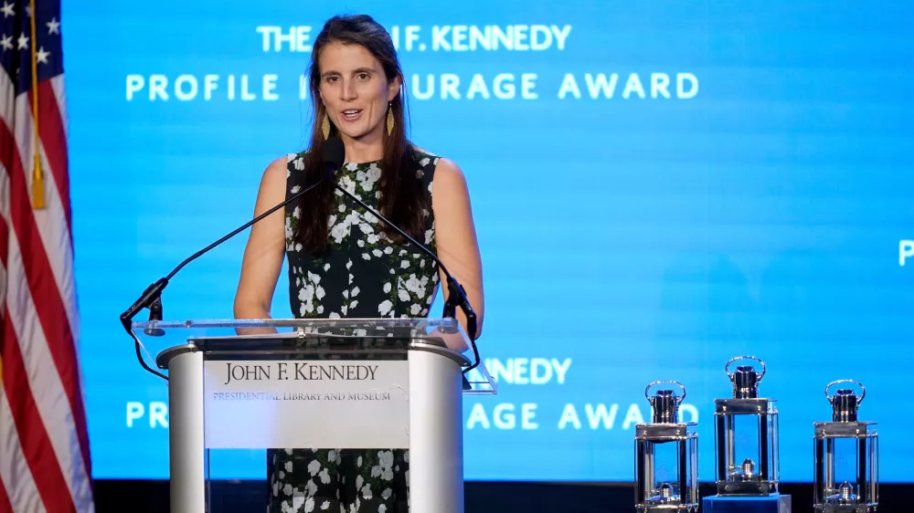 FILE - Tatiana Schlossberg, daughter of Caroline Kennedy, ambassador of the United States to Australia, addresses the audience during the John F. Kennedy Profile in Courage Award ceremony, Sunday, Oct. 29, 2023, at the John F. Kennedy Presidential Library and Museum, in Boston. (AP Photo/Steven Senne, File)