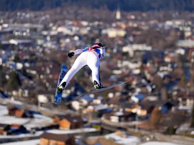 Abigail Strate, of Canada, soars through the air during her first round jump at the women's ski jumping World Cup competition in Garmisch-Partenkirchen, Germany, Wednesday, Dec. 31, 2025. (AP Photo/Matthias Schrader)
