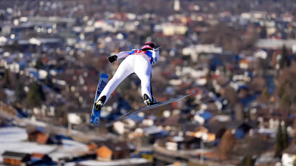 Abigail Strate, of Canada, soars through the air during her first round jump at the women's ski jumping World Cup competition in Garmisch-Partenkirchen, Germany, Wednesday, Dec. 31, 2025. (AP Photo/Matthias Schrader)